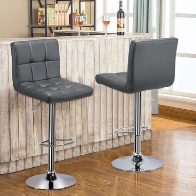Des tabourets de bar modernes réglables en hauteur contre hauteur des tabourets de bar